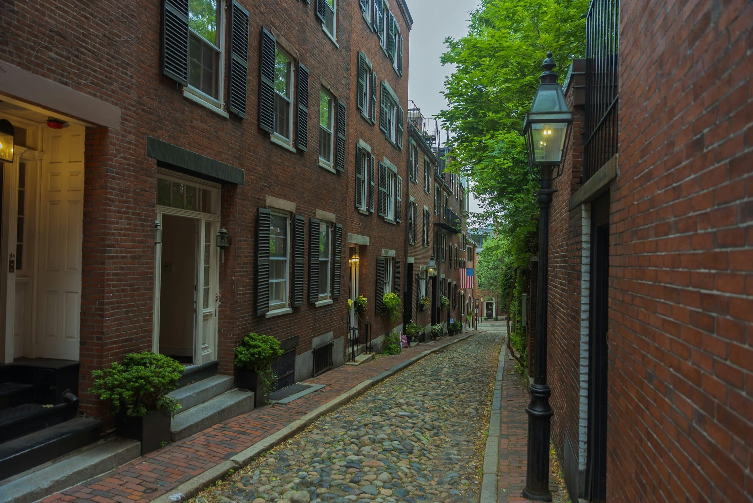 Cobblestone street lined with historic brick buildings in German Village, Columbus Ohio
