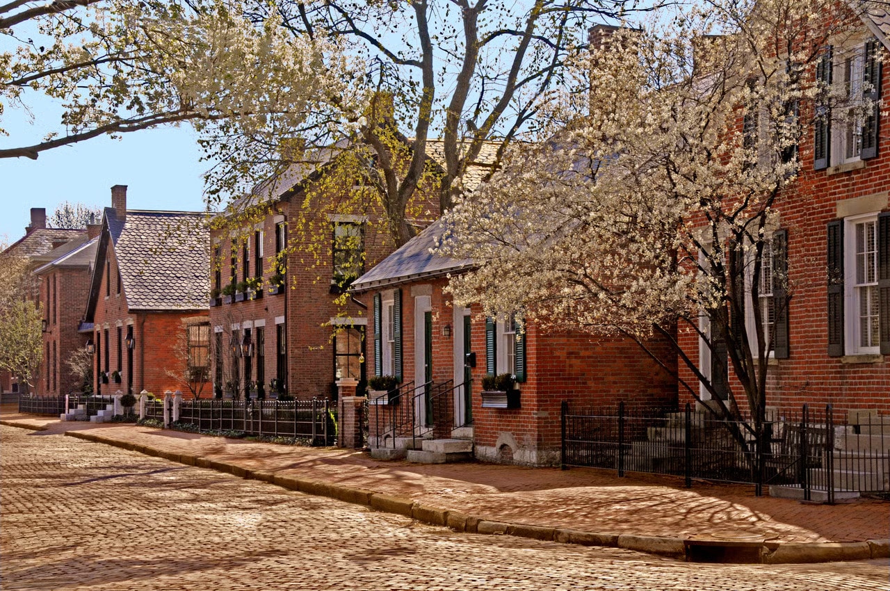 Historic brick homes along a cobblestone street in German Village, Columbus Ohio