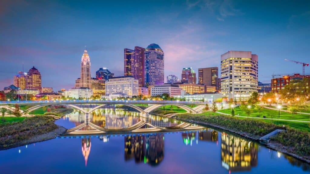 Cost of living in Columbus Ohio, downtown skyline over the Scioto River at dusk